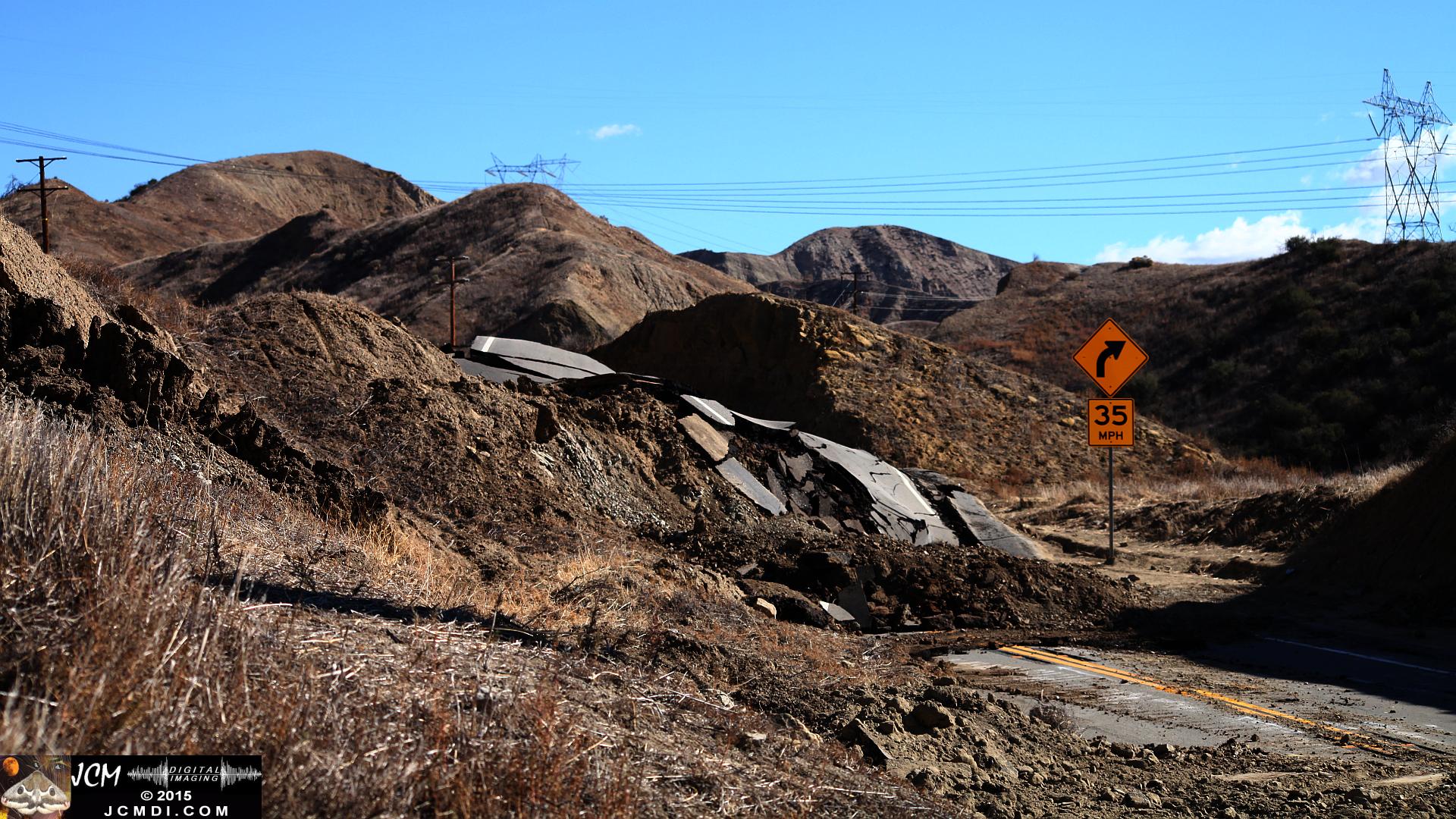 Landslide, buckled pavement, and terrain at Vasquez Canyon Road in Santa Clarita, CA filmed 11-25-2015
